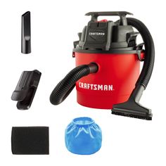 a red and black vacuum with cleaning supplies