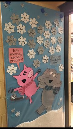 a door decorated with snowflakes and pigs