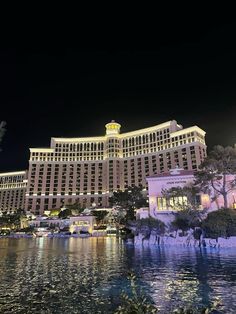 the las vegas hotel and casino is lit up at night