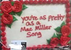 a sheet cake decorated with red roses and the words you're as pretty as a mac miller song