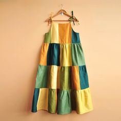 a colorful dress hanging on a wall