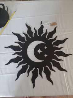 a sun and moon cut out on a table