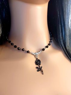 Gothic style Black Rose beaded chain necklace choker. Crafted with meticulous attention to detail, this choker features an intricate and elegant design that exudes both charm and darkness. The black finish adds a touch of sophistication, while the gothic-inspired motifs lend an air of mystique to your ensemble. The most unique jewelry you can find, perfect gift for you and your loved one. We also can add a gift message with your purchase! Just drop us a message or add a note when you check out. Spring Goth Necklace, Black Flower Necklace, Silver Necklaces With Rose Design For Party, Silver Necklace With Rose Design For Parties, Party Choker Necklace With Rose Design, Black Beaded Clavicle Chain Choker, Rose Design Choker Necklace, Adjustable Rose Design Choker Necklace, Elegant Rose Design Choker Jewelry