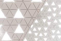 the ceiling is decorated with white triangles