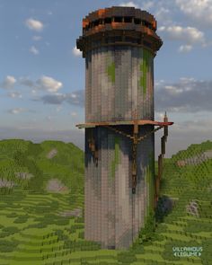 a tall tower sitting on top of a lush green field next to a sky filled with clouds