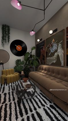 a living room filled with lots of furniture next to a wall mounted record on the wall