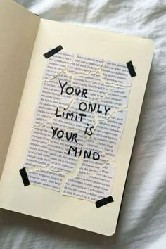 an open book with the words your only limit is your mind taped to it's cover