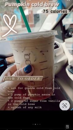 someone holding up a cup with a straw in it and the text pumpkin cold brew 7 calories