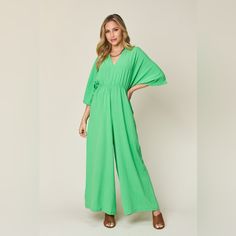 Features: Tied, Ruched Sheer: Opaque Material Composition: 95% Polyester, 5% Spandex Care Instructions: Machine Wash Cold. Tumble Dry Low. Imported Green V-neck Jumpsuit For Loungewear, Green Stretch Jumpsuits And Rompers For Spring, Chic Green Jumpsuit With Elastic Waistband, V-neck Jumpsuits And Rompers With Elastic Waistband For Spring, Spring V-neck Jumpsuits And Rompers With Elastic Waistband, Green Stretch Jumpsuits And Rompers For Vacation, Green Jumpsuits And Rompers For Spring Loungewear, Green Jumpsuits And Rompers With Elastic Waistband For Spring, Green Stretch Jumpsuit For Vacation