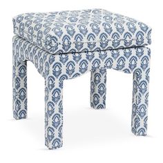 a blue and white patterned stool with legs