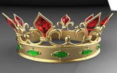 a gold crown with red and green jewels