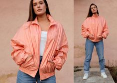 "Orange 90s Track Jacket Vintage 90s Track Top, Oldschool Windbreaker, Peach Retro Track Suit Top, Nylon Sports Top, Vintage Activewear, M/L - In great vintage condition, no flaws noted - Size on the label: S - Fits size XS - L depending on fit (the model is 5'6\" and wears size S/EU36) - Shell: 100% Polyamid; Lining: 65% Polyester, 35% Cotton MEASUREMENTS Bust 25\" Sleeve length 23\" Length 25.5\" Width at the bottom 16\" (stretches up to 20\") Waist 17\" The item will be shipped in 1-3 days af 90s Style Windbreaker With Pockets For Spring, Vintage Spring Sports Windbreaker, 90s Style Pink Windbreaker For Spring, 90s Pink Spring Windbreaker, Vintage Pink Windbreaker For Spring, Vintage Activewear, Peach Jacket, Casual Outfit Inspiration, Quick Outfits