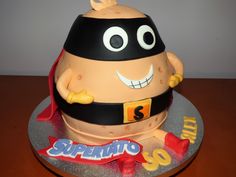 a birthday cake made to look like a super hero