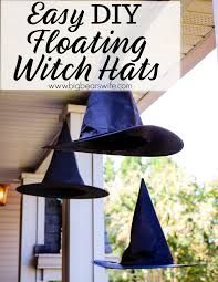 three witches hats hanging from the side of a house with text overlay that says easy diy floating witch hats