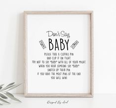 a framed print with the words don't say baby on it