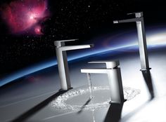 two faucets in the middle of a space with stars and planets behind them