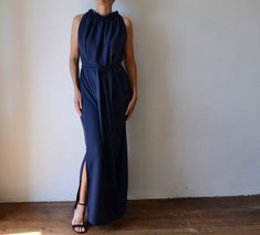 "THIS DRESS IS READY TO SHIP Made of beautiful slinky fabric in midnight blue, this long, elegant grecian style maxi dress is breathtaking. Adding to the beauty of the fabric is the draping, which is created by a delicate row of elastic at the neckline from which the dress falls. Very elegant and feminine in its cut, it falls straight down revealing only a hint of shoulder. The sash belt gently gathers the folds of fabric to accentuate your waist, without adding bulk. It is free of closures, whi Dress For Formal Event, Indigo Blue Wedding, Dresses For Formal Events, Dress For Formal, Cotton Tunic Dress, Grecian Style, Backless Tank Top, Evening Skirts, Summer Tunics