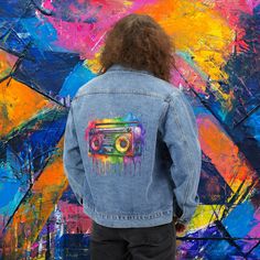 Step back in time with our Watercolor Splash Stereo Men's Denim Jacket, inspired by the iconic fashion of the 80s and 90s. This nostalgic jean jacket features a classic lapel collar and button-front closure for a timeless look, while the medium denim wash adds a touch of rugged charm to any outfit. Made from a blend of 90% cotton, 6% polyester, 3% rayon, and 1% spandex, it offers a comfortable relaxed fit and lasting durability. With convenient front slant pockets, this jacket is as functional as it is stylish, making it the perfect gift for him. Sewn-in label on the bottom left side adds a subtle touch of authenticity. Embrace retro fashion with this versatile and nostalgic wardrobe staple. RETURNS OR EXCHANGES *Please understand that as all of our items are custom printed after you order Multicolor Denim Jacket For Streetwear, Retro Acid Wash Cotton Denim Jacket, Retro Cotton Acid Wash Denim Jacket, Retro Denim Jacket With Graphic Print For Streetwear, Denim Jacket Vintage, Unique Jackets, Unique Gifts For Him, Iconic Fashion, Retro Mode