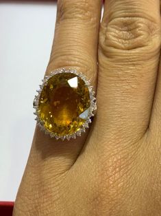 Stunning 14k solid white gold halo ring featuring an oval yellow gemstone surrounded by a halo of cubic zirconia for extra sparkle. This statement piece is perfect for special occasions or adding a touch of glamour to your everyday look Metal - 14k Solid Gold Stones - Yellow Topaz and Cubic Zirconia Grams - 8.8g FREE SHIPPING Within USA FREE Gift Box About Us With 30 years of jewelry experience and a Top Rated Seller on eBay since 2011, Goldland Jewelry strives to provide quality handcrafted jewelries at the best price. 30 Day Return after delivery for full refund. Oval Yellow Sapphire Diamond Ring Fine Jewelry, Yellow Sapphire Oval Diamond Ring, Oval Yellow Sapphire Rings With Brilliant Cut, Oval Brilliant Cut Yellow Sapphire Rings, Brilliant Cut Oval Yellow Sapphire Rings, Fine Jewelry Yellow Topaz Ring With Halo Setting, Luxury Oval Yellow Sapphire Diamond Ring, Yellow Topaz Halo Ring Fine Jewelry, Yellow Topaz Ring With Halo Setting