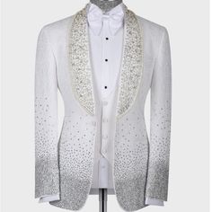 a white tuxedo jacket with sequins on the lapel and collar