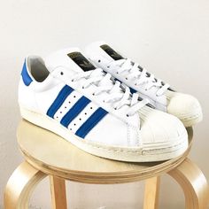 Adidas Superstar 80's White / Blue Size: 13.5 US Released: 2008 These shoes are retro'd versions of the 1980s French made Superstars. Very high quality and extremely rare. Different details and quality from the versions released in 2016. White leather upper with blue suede stripes. Feel free to ask any questions and thanks for looking! Adidas Super Star, Adidas Superstar 80s, Adidas Super, Star Blue, Super Star, Blue Adidas, Blue Suede, Leather Sneakers, Size 13