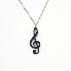 "Designed and created in the UK by Mother and Daughter, Hannah and Wendy Richardson in our Folkestone workshop. Laser cut 3mm black acrylic necklace. Other colours on request, please message us. Approx. 16mm x 40mm. On 18\" silver plated chain. In presentation box. Part of our music range, please see other items listed in our shop." Music-themed Pendant Jewelry As Gift, Music-themed Pendant Necklace As Gift, Music-themed Pendant Jewelry For Gifts, Silver Sterling Music-themed Necklace, Music-themed Pendant Necklace, Treble Clef, Black Acrylics, Silver Plate, Necklace Etsy