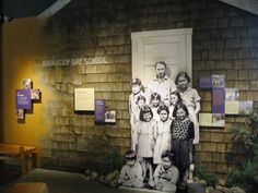 an old photo is displayed on the side of a building