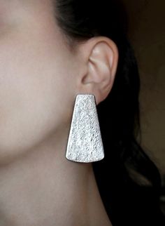 Large stud earrings, clip on earrings for non pierced ears, bold silver studs, big earrings, special gift for women, modern minimalist jewelry. Also available in gold and copper colors. You can combine perfectly with lovely statement bib necklace in the prefered color. See the necklace here: https://www.etsy.com/listing/491474353 Handmade with LOVE! Size: 1.9 inch x 1.1 inch (4.9 cm x 2.9 cm) Here you can take a look at the other clip on earring designs that are available at Gita's Jewelry Shop: Gold Bib Necklace, Kinetic Jewelry, Earrings Bold, Big Stud Earrings, Non Pierced Earrings, Large Stud Earrings, Abstract Jewelry, Indie Jewelry, Large Necklace