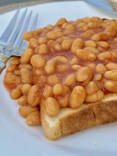 there is a piece of bread with beans on it