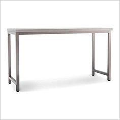 a white table sitting on top of a wooden floor next to a metal frame structure