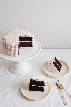 two plates with slices of cake on them