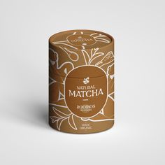 a brown box with white designs on the lid that says natural matcha rooibos