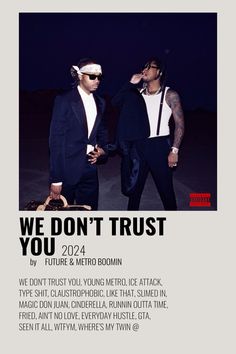 two men standing next to each other in front of a black and white poster with the words we don't trust you