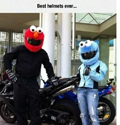 two people in costumes standing next to a motorcycle and sesame the cookie monster on it