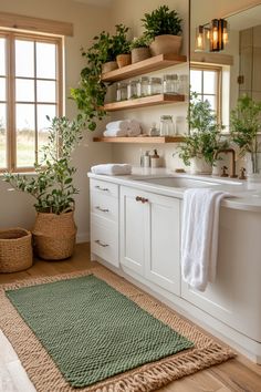 Create a calming, sage green bathroom with these quick tips and simple design ideas. Sage Green Guest Bathroom, White And Sage Bathroom, Greenery In Bathroom, Green Cottage Bathroom, Green Restroom Ideas, Sage Green And Pink Bathroom, Bathroom Ideas Sage Green, Green Spa Bathroom, Earthy Tone Bathroom