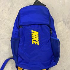 Nwt Nike Brasilia Varsity Training Backpack Blue Gold Da2279-455 Functional Blue Nylon Bags, Functional Large Capacity Blue Bag, Blue Nylon School Bag, Blue Student Bags, Sporty Blue Nylon Bag, Sporty Blue Bag With Adjustable Strap, Blue Nylon Everyday Backpack, Everyday Blue Nylon Backpack, Blue Bags For Back To School