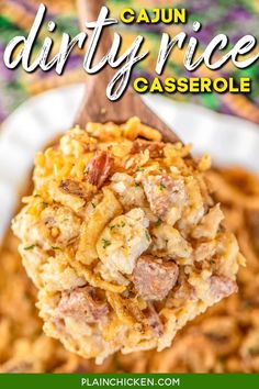 a spoon full of casserole on top of a white plate with the words cajun dirty rice casserole