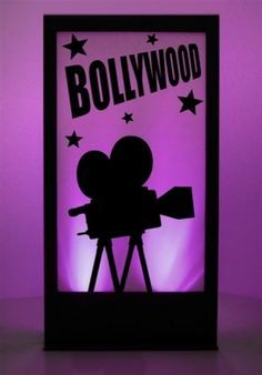 the silhouette of a camera is shown in front of a purple background that says,'hollywood '