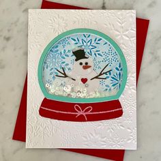 a card with a snow globe on it