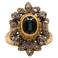 A beautiful 18 kt gold and silver ring. This ring is original vintage from the 1940s/50s era. It is handmade in Italy and is embellished with a dark blue oval-cut sapphire and antique-cut diamonds. The 18 kt gold center bezel has beautiful and original fringed work as well as the ring shank has embossed work. For this reason, it would be preferable not to tighten or widen the size. It is still possible to put it to size . The sapphire measures approximately 7x5 mm. The ring has a total weight of gr. 7.20 The size is 19 (59 EU) (8.5 US). This jewelry is new and is shipped with box and certificate of authenticity from our store which has experience selling antique and vintage jewelry since 1934. Gold And Silver Ring, Ring Shank, Gold And Silver Rings, Selling Antiques, Gold Diamond Rings, Sapphire Diamond, Jewelry Rings Engagement, Gold And Silver, Oval Cut