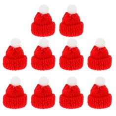 twelve red knitted hats with white pom - poms