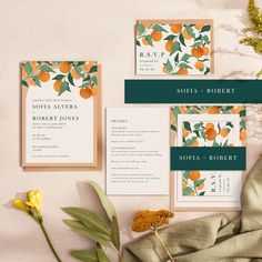 wedding stationery with oranges and greenery