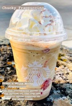 a close up of a cup of food on a rock with the words chucky frappuccino