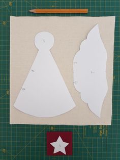 paper cut out to look like a woman's dress with a star on it