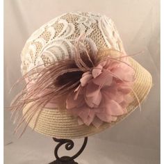 A lovely  1920's vintage-inspired beige cloche hat with lace ivory crown.  This vintage inspired straw hat has an antique lace crown, accented with mauve chiffon band and antique mauve chiffon flowers and ostrich plume. Cream Cloche Hat For Spring Garden Party, Cream Spring Cloche Hat, Vintage Beige Summer Fascinator, Beige Cloche Mini Hat For Spring, Vintage Beige Cloche Hat For Spring, Beige Cloche Hat With Short Brim For Garden Party, Beige Cloche Hat For Spring Garden Party, Spring Vintage Cloche Mini Hat, Adjustable Beige Cloche Hat For Garden Party