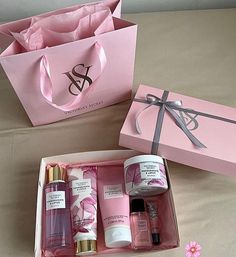 a pink gift box filled with personal care items