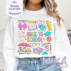 the back to school sweatshirt is shown with an image of books and other items on it