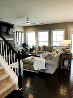 a living room filled with furniture and a fire place