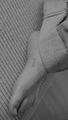 a person's foot with the word love tattooed on it