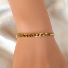 "Look ravishing any day of the week with this delicate gold chain bracelet. Crafted with a dainty gold link, it's the perfect accessory to dress up any casual look.  ♡︎ 𝘼 𝙥𝙤𝙧𝙩𝙞𝙤𝙣 𝙤𝙛 𝙥𝙧𝙤𝙛𝙞𝙩𝙨 𝙛𝙧𝙤𝙢 𝙚𝙫𝙚𝙧𝙮 𝙤𝙧𝙙𝙚𝙧 𝙞𝙨 𝙙𝙤𝙣𝙖𝙩𝙚𝙙 𝙩𝙤 𝙒𝙤𝙢𝙚𝙣 𝙞𝙣 𝙣𝙚𝙚𝙙 ♡︎ ꕥ 𝗢𝗨𝗥 𝗝𝗘𝗪𝗘𝗟𝗥𝗬 𝗜𝗦 ꕥ * High Quality * Handmade * Waterproof  * 100% Lead & Nickel Free  * Won't tarnish or discolour * Hypoallergenic * Recyclable ꕥ 𝗠𝗔𝗧𝗘𝗥𝗜𝗔𝗟𝗦 ꕥ * 18K Gold Plated PVD Stainle Adjustable Cuban Link Elegant Bracelet As Gift, Elegant Adjustable Cuban Link Bracelet As Gift, Elegant Adjustable Cuban Link Bracelet For Gift, Minimalist Tarnish Resistant Cuban Link Bracelet As Gift, Minimalist Cuban Link Bracelet, Tarnish Resistant, Gift, Adjustable Cuban Link Bracelet As Gift, Adjustable Cuban Link Bracelet Gift, Cuban Link Bracelet, Dainty Gold Bracelet